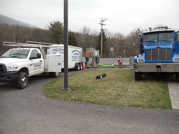 chamberlin working on a drain line cleaning